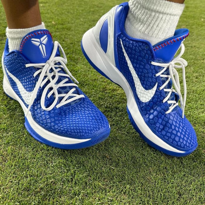 Side view of Natalia Bryant's blue and white Nike Kobe sneakers.